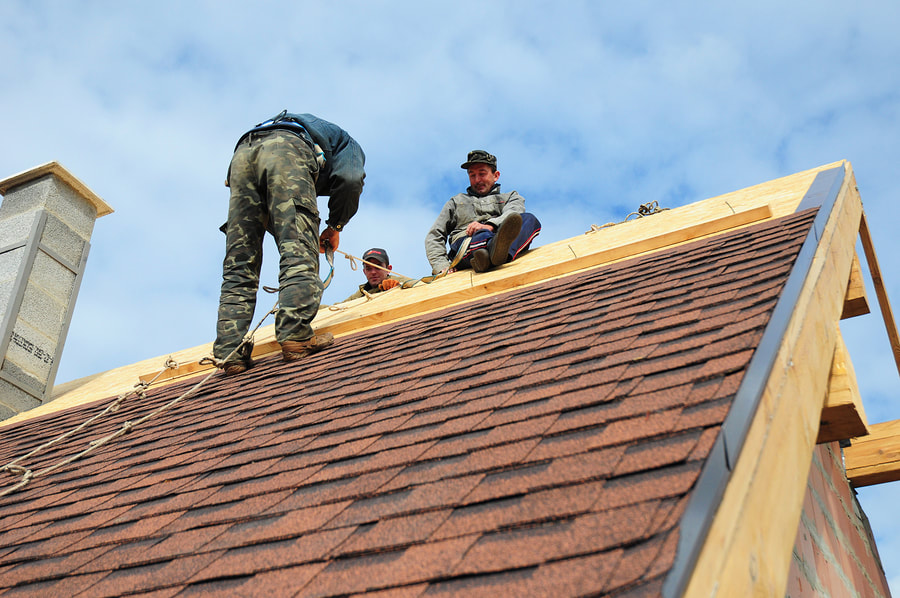 men installing a roof