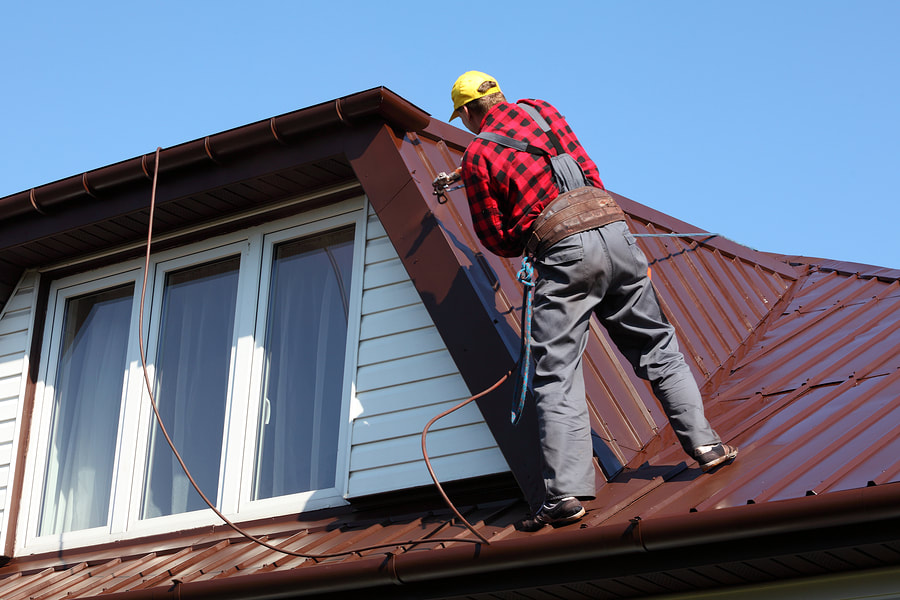 man fixing a roof